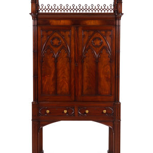 Appraisal: A Gothic Style Carved Mahogany Cabinet with P E Guerin