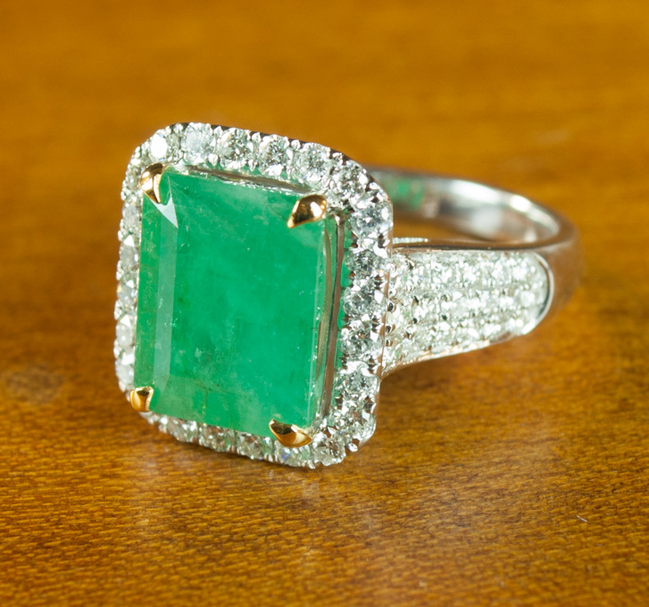 Appraisal: EMERALD DIAMOND AND FOURTEEN KARAT GOLD RING The white gold