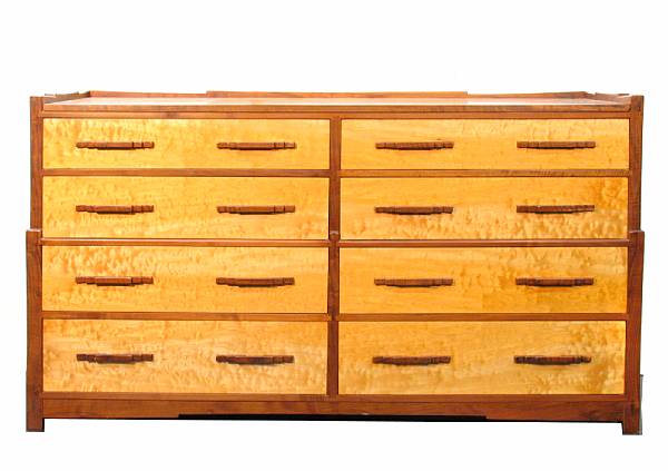 Appraisal: A Contemporary satin birch and walnut chest of eight drawers