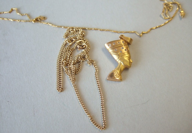 Appraisal: A gold and diamond set pendant designed as the head