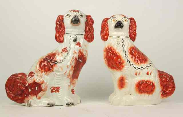 Appraisal: Two liver and brown Staffordshire dogs cm high