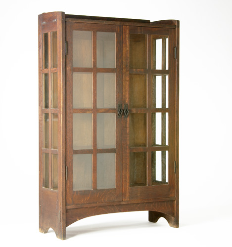 Appraisal: GUSTAV STICKLEY Two-door china cabinet with eight panes per door