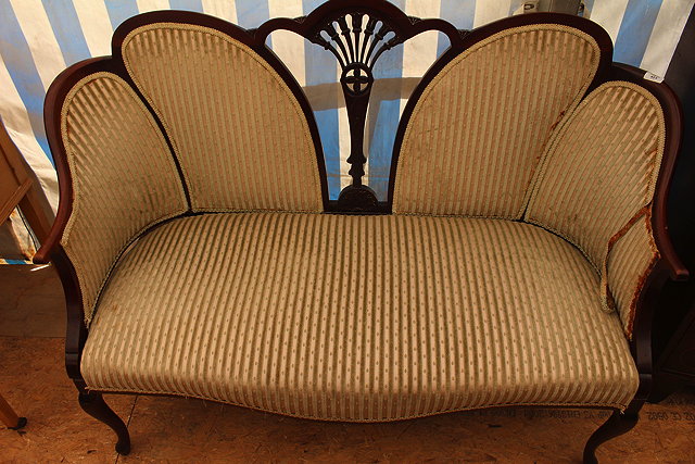 Appraisal: AN EDWARDIAN MAHOGANY FRAMED TWO SEATER SOFA with striped upholstery