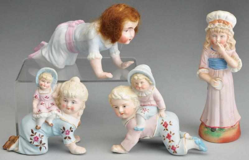 Appraisal: Loft of All-Bisque Figurines Description Unmarked but German Pair of