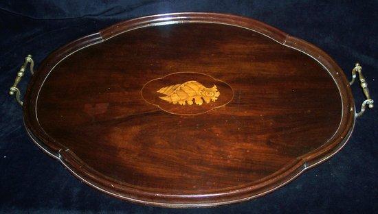 Appraisal: An Edwardian mahogany tray of shaped oval form with central