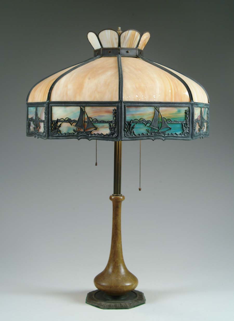 Appraisal: BENT PANEL LAMP Large lamp shade has eight carmel slag