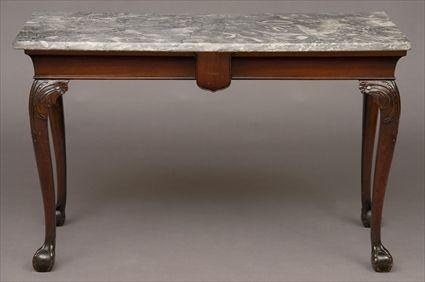 Appraisal: GEORGE II CARVED MAHOGANY CONSOLE TABLE The marble top above