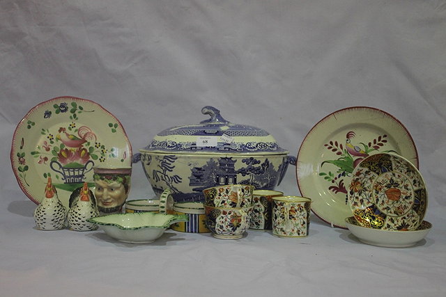 Appraisal: A COLLECTION OF POTTERY PIECES to include a willow pattern