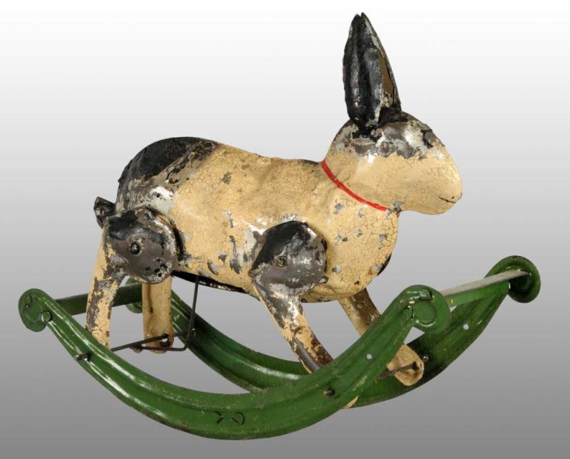 Appraisal: Tin Hand-Painted Rabbit on Rocker Wind-Up Toy Description German Working