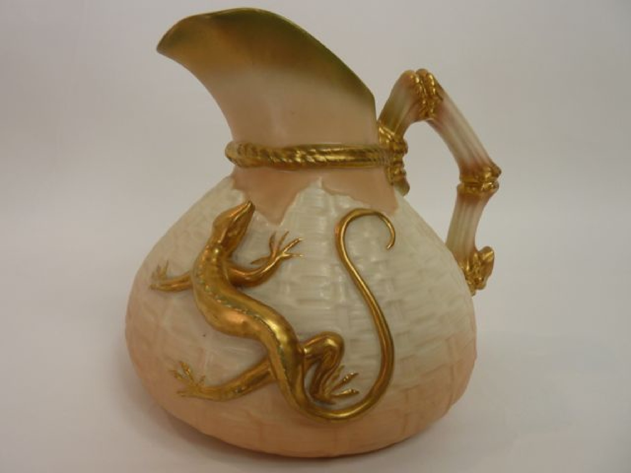 Appraisal: A Royal Worcester jug with simulated uneven basketwork moulding and