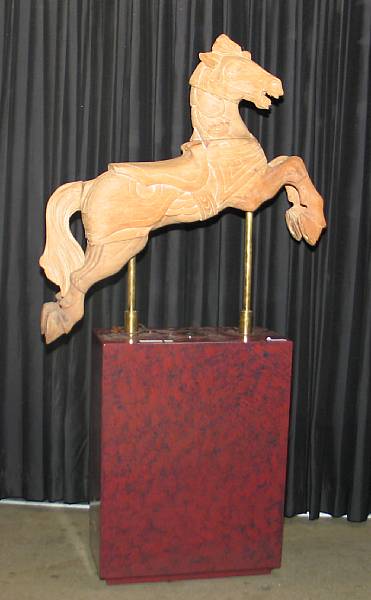 Appraisal: A stained pine carousel horse on stand mid th century