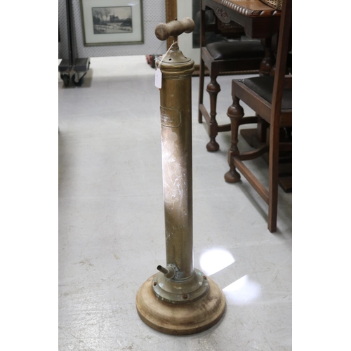 Appraisal: Antique French brass pump wooden base and handle approx cm