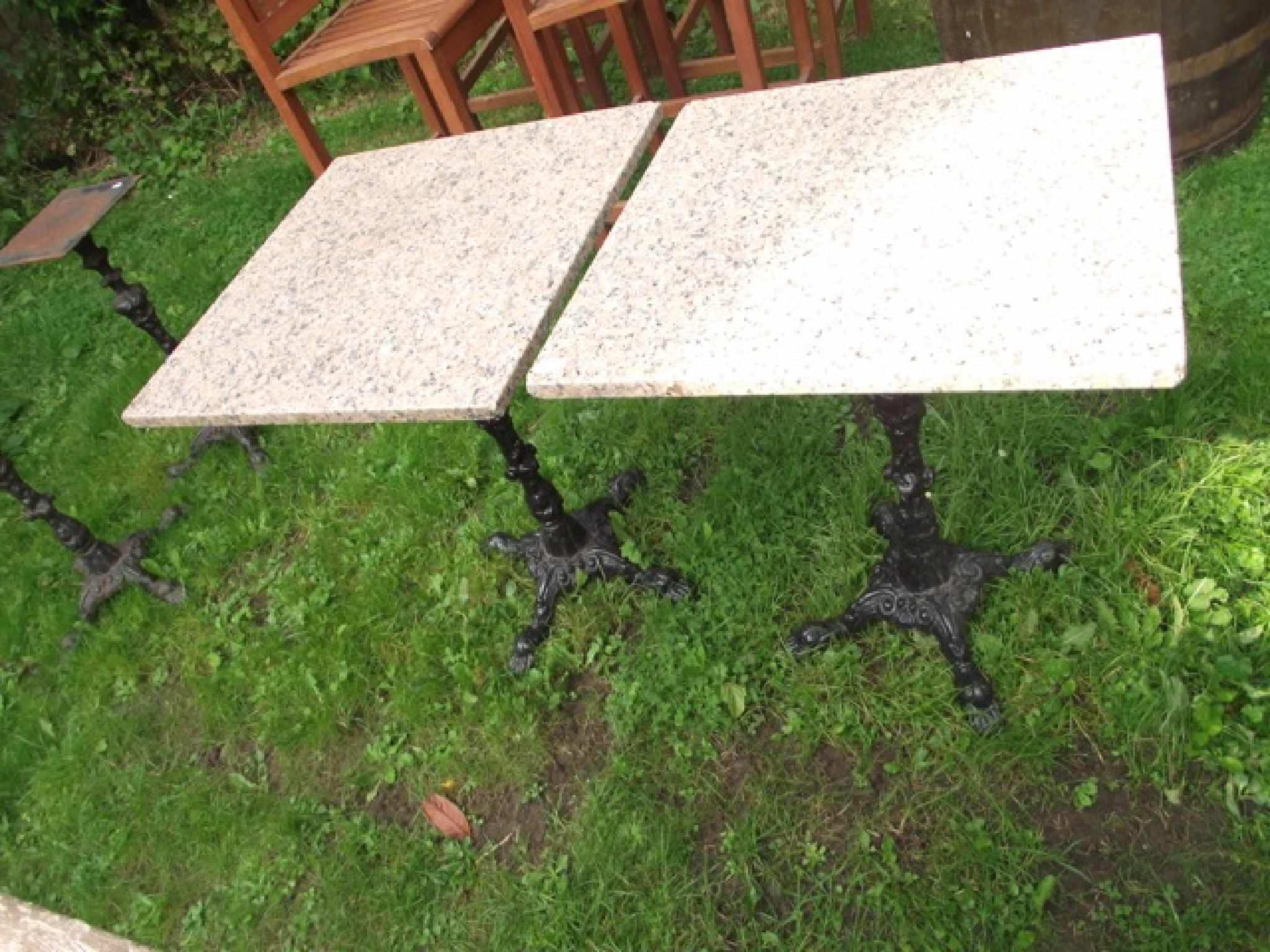 Appraisal: A pair of cast iron tables with iron bases and