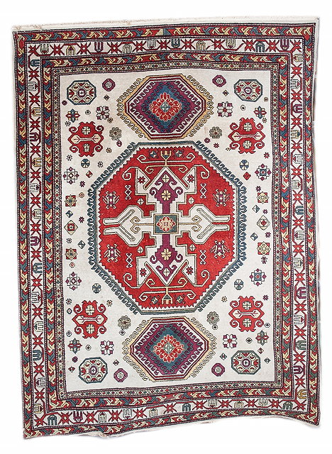 Appraisal: A MODERN CAUCASIAN RUG with allover polychrome geometric decoration within