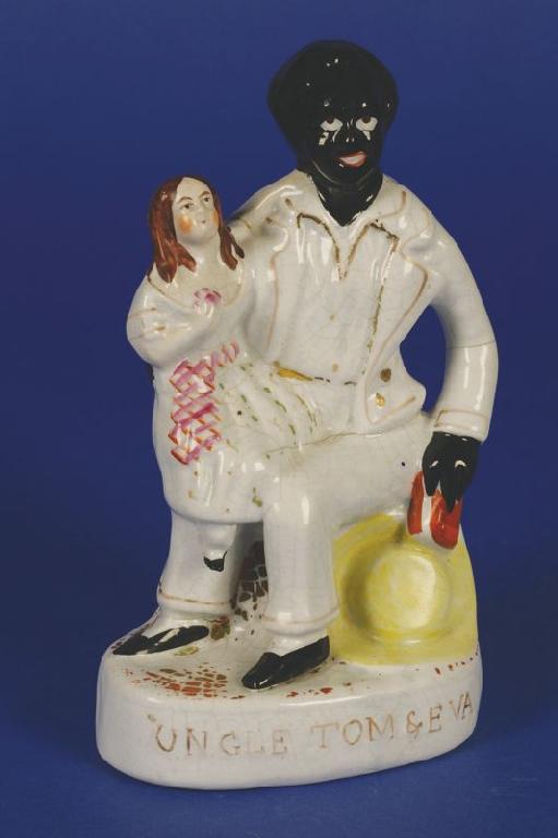 Appraisal: A STAFFORDSHIRE POTTERY GROUP Uncle Tom and Eva painted in