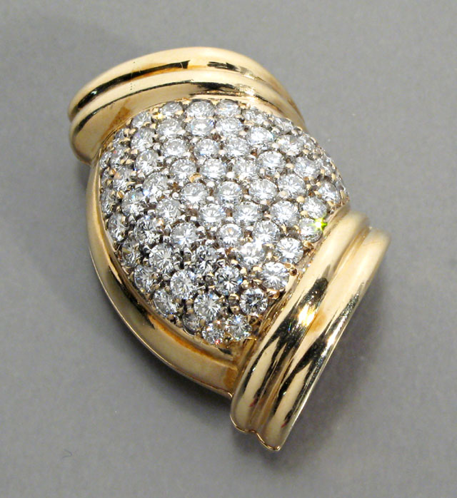 Appraisal: DIAMOND AND FOURTEEN KARAT GOLD SLIDER PENDANT the curved dome