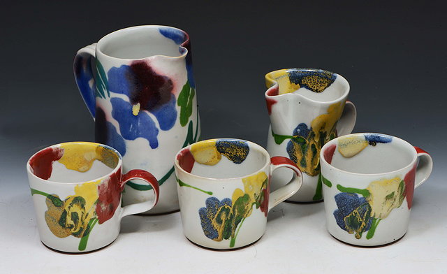 Appraisal: Dart PotteryTwo jugs and three mugs painted and slip trailed