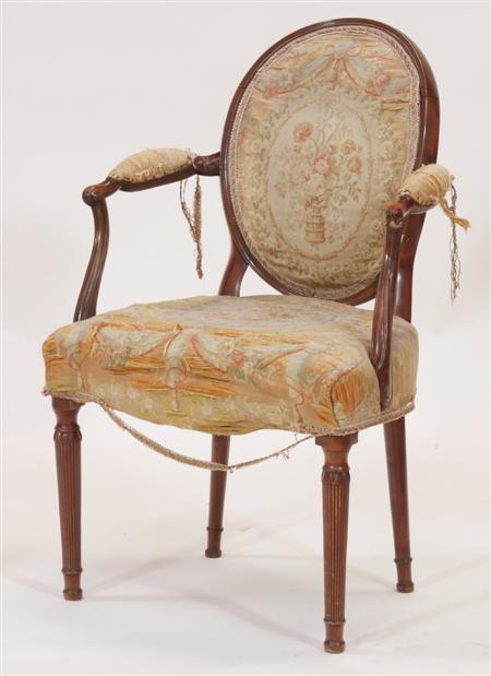 Appraisal: A George III mahogany and upholstered armchair the moulded oval