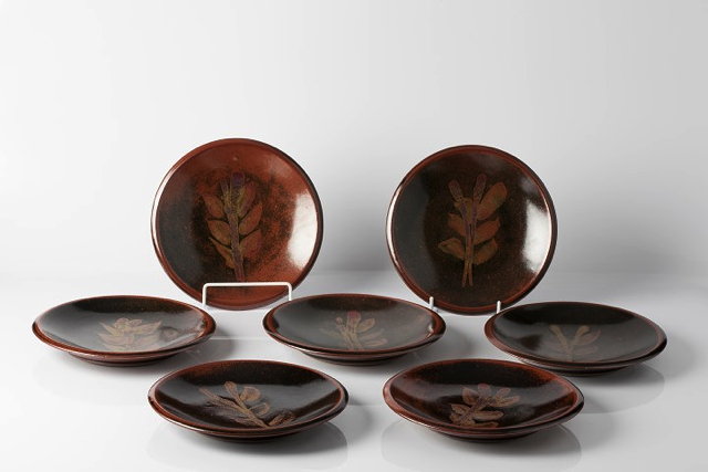 Appraisal: Les Blakebrough Australian b Set of tenmoku platesfoliate sprig motifsimpressed