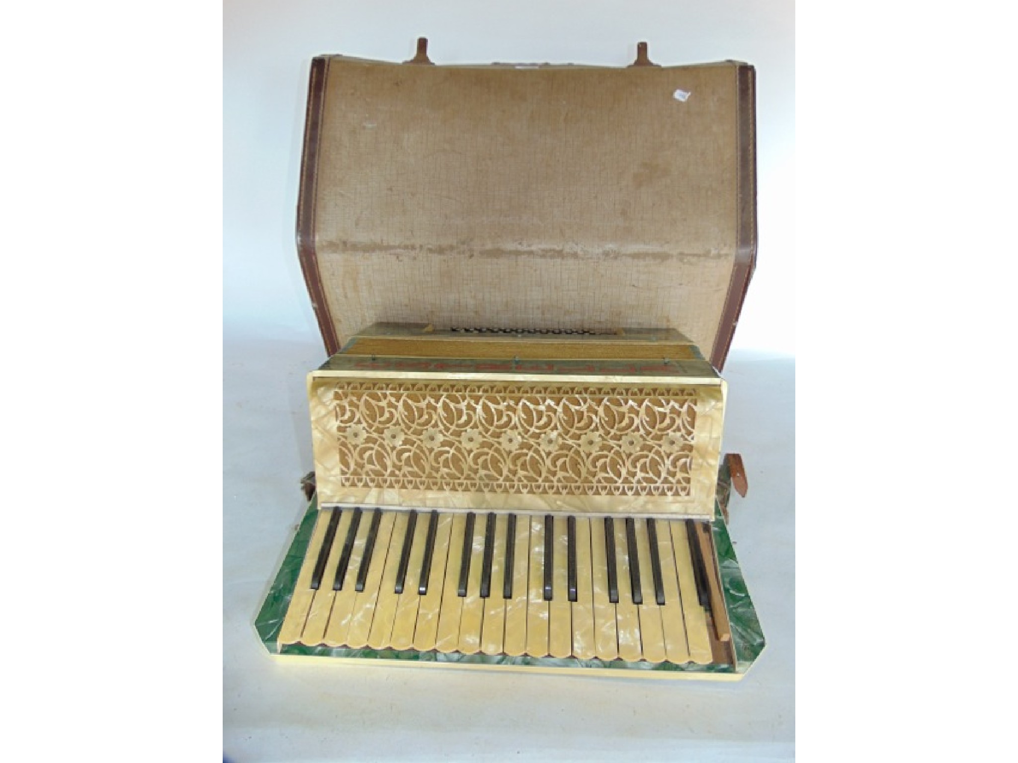 Appraisal: A th century cased piano accordion with shellac casing marked