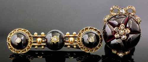 Appraisal: A Victorian gold coloured metal mounted garnet and diamond set