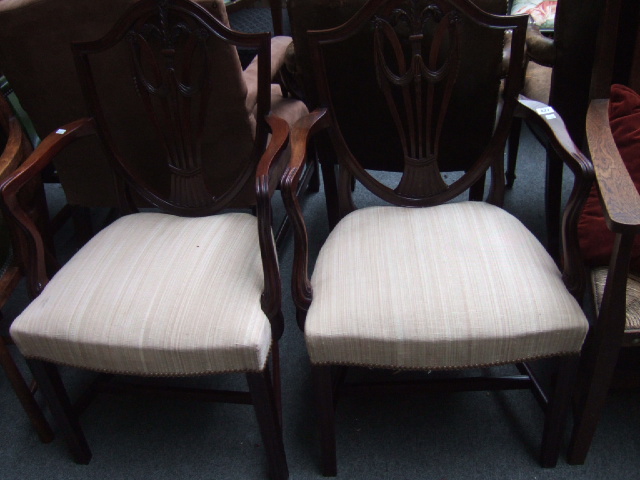 Appraisal: A pair of early th century mahogany shield back dining