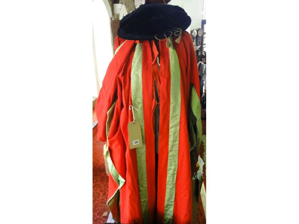 Appraisal: A LLD red gown with green silk trimming and a