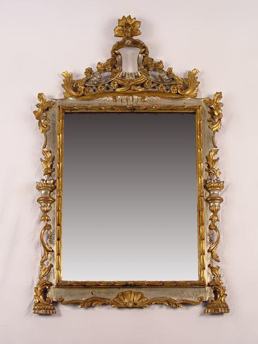 Appraisal: CARVED SILVER AND GOLD GILT MIRROR Elaborately carved wood and