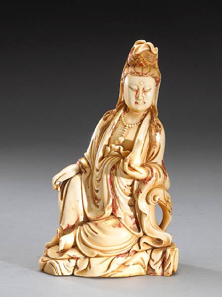 Appraisal: A polychrome and gilt lacquered ivory figure of Guanyin th