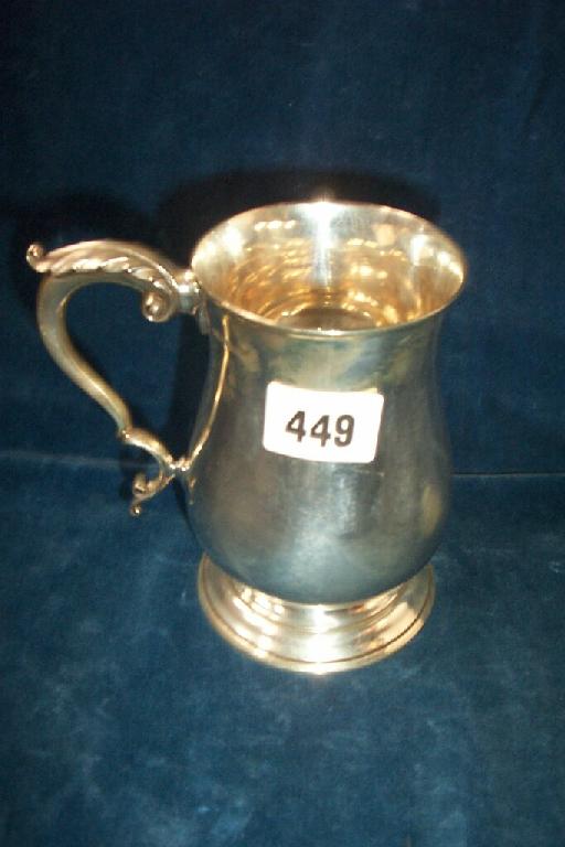 Appraisal: A heavy Georgian style silver pint tankard of baluster form