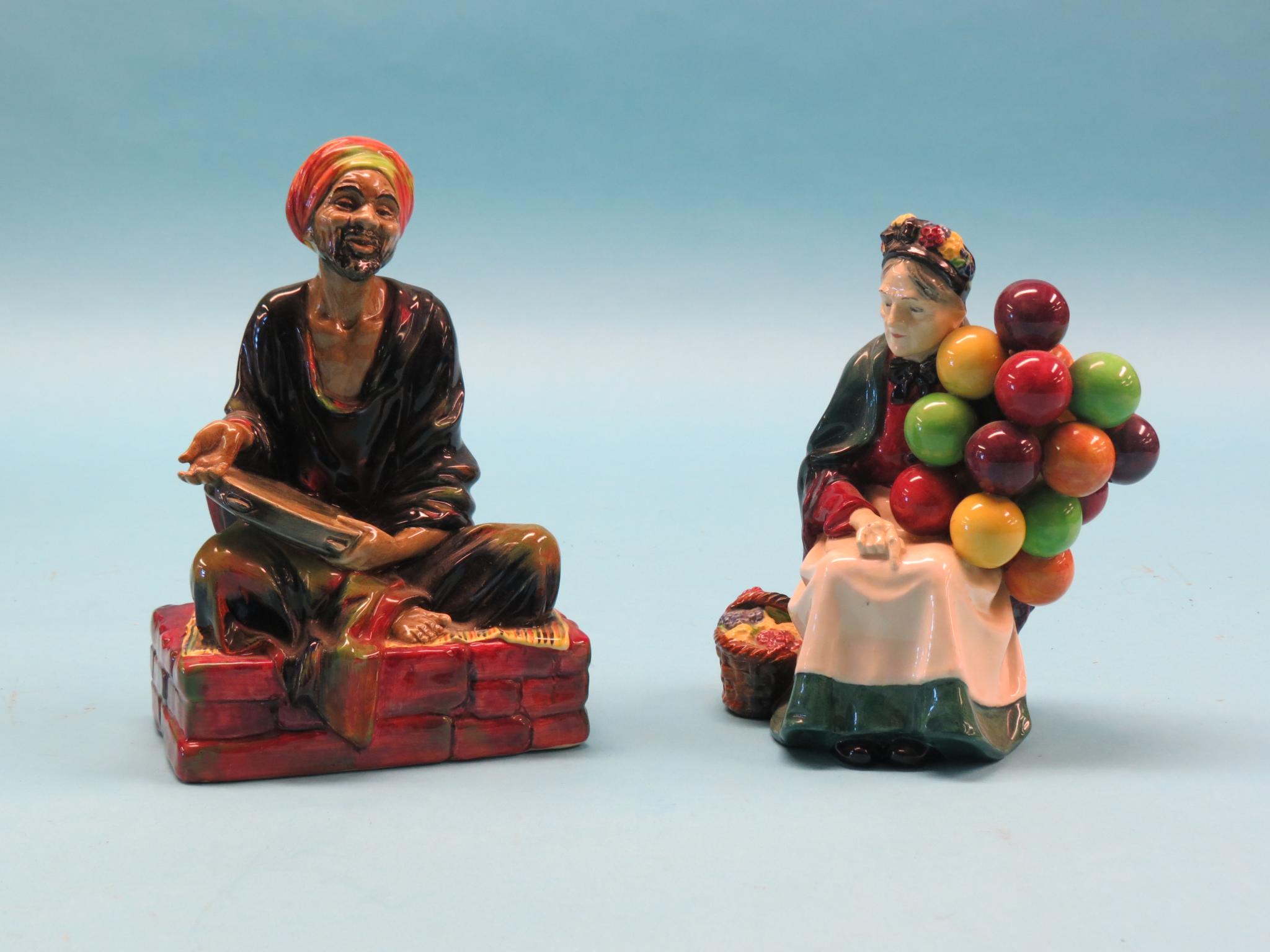 Appraisal: Two Royal Doulton earthenware figures Mendicant HN Old Balloon Seller