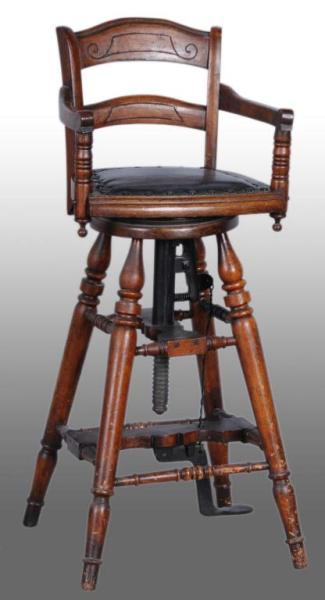 Appraisal: Early Child's Oak Barber Chair Description Height adjusts with foot