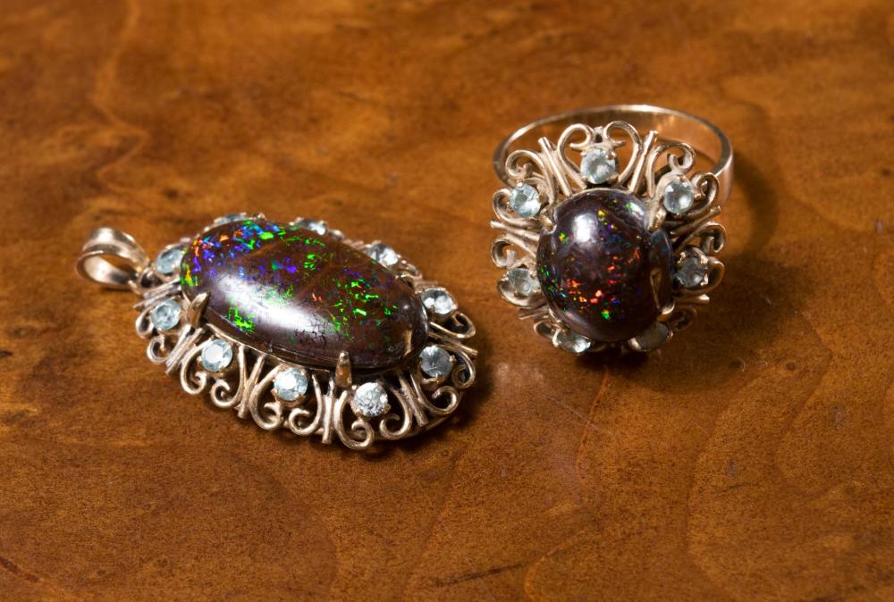 Appraisal: BLACK OPAL AND AQUAMARINE RING AND PENDANT SET including a