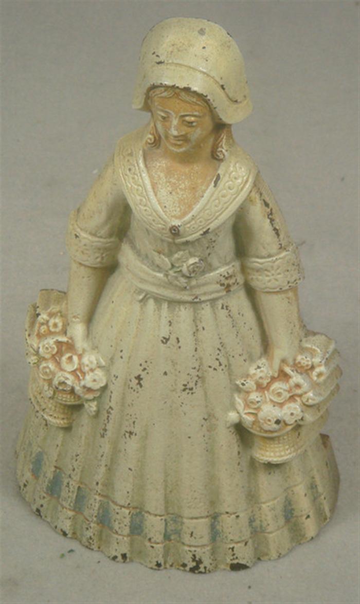 Appraisal: Cast iron doorstop free standing hollow back woman with flower