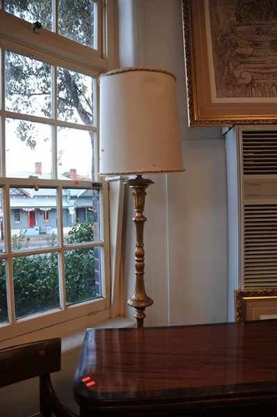 Appraisal: A GILDED STANDARD LAMP WITH SHADE