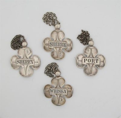 Appraisal: A matched set of four modern cast 'shamrock' wine labels