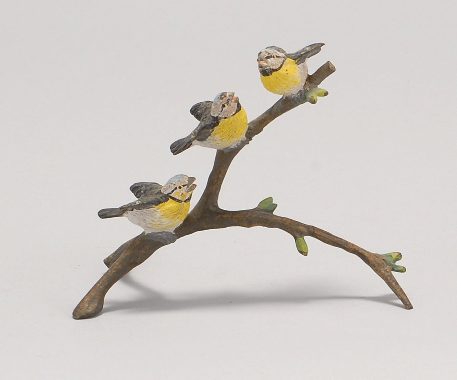 Appraisal: AUSTRIAN COLD-PAINTED BRONZE FIGURE Three songbirds on a branch Height