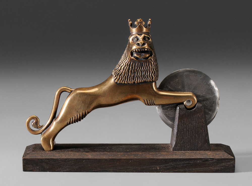 Appraisal: Tom Latan Brass Pizza Cutter shaped as full-figured striding lion