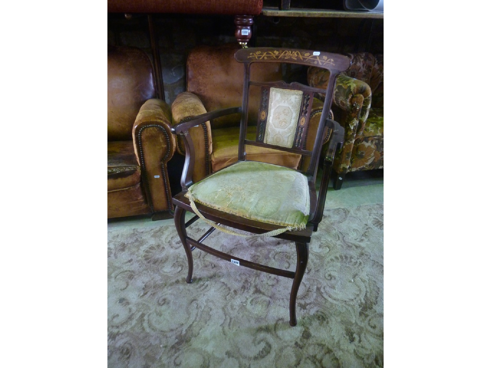 Appraisal: An inlaid Edwardian mahogany open elbow chair with floral marquetry