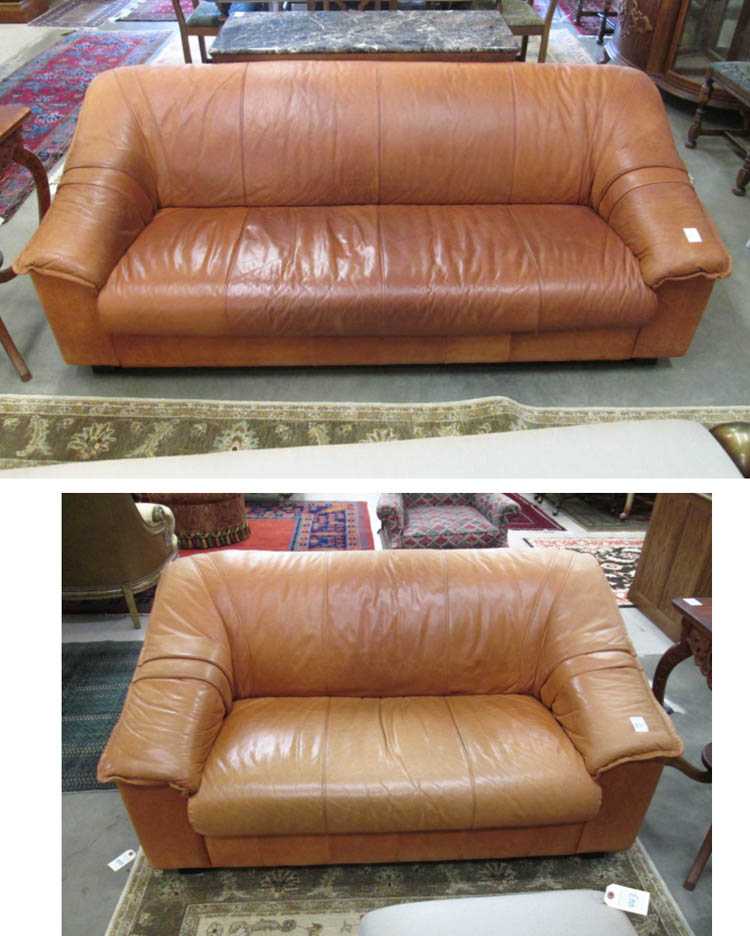 Appraisal: MODERN LEATHER COUCH AND LOVESEAT SET unknown maker matching orange-brown