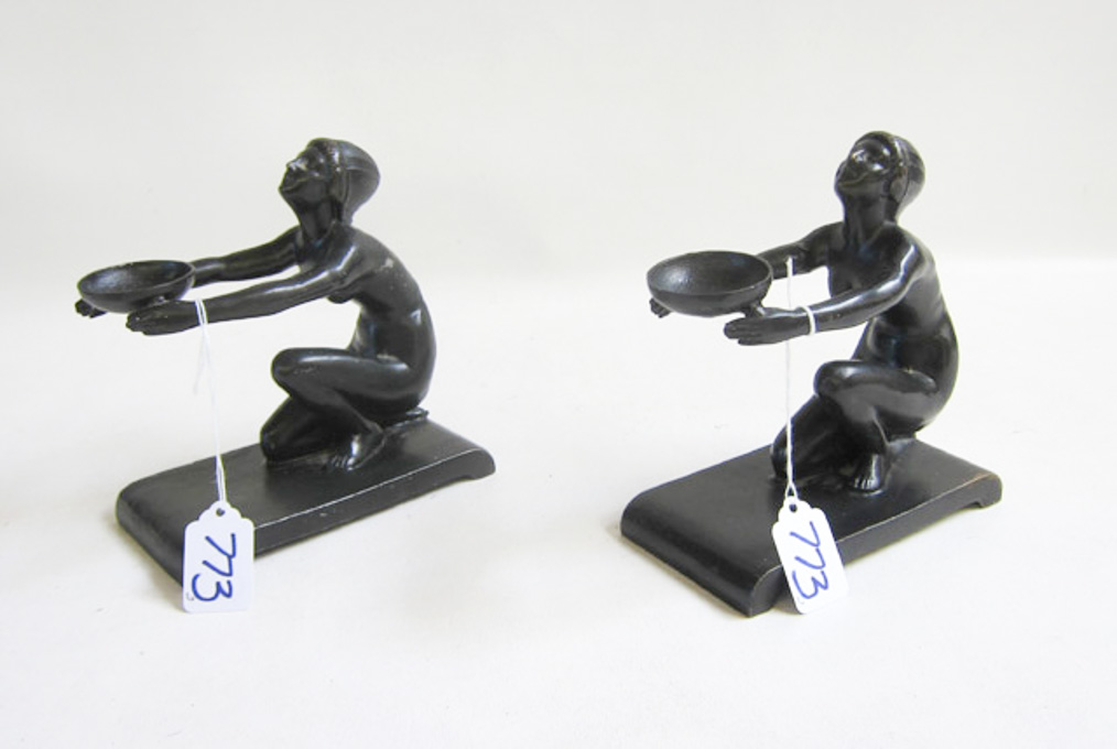 Appraisal: PAIR OF METAL DECO STYLE BOOKENDS of squatting nude figures