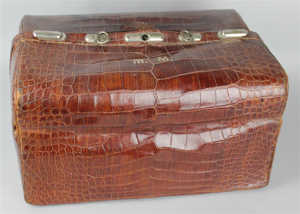 Appraisal: LARGE CROCODILE BAG WITH EARLY TH C TRAVEL KIT POSSIBLY