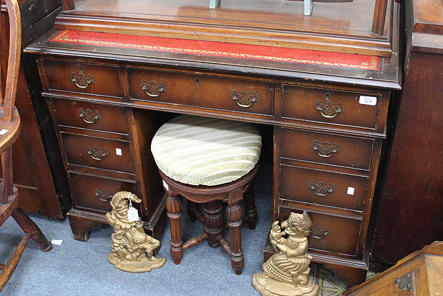 Appraisal: A PEDESTAL DESK with red leather inset top cm wide