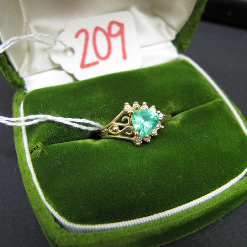 Appraisal: EMERALD DIAMOND AND FOURTEEN KARAT GOLD RING featuring a prong