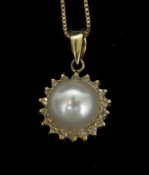 Appraisal: A Diamond and Pearl Pendant on a Chain k yellow