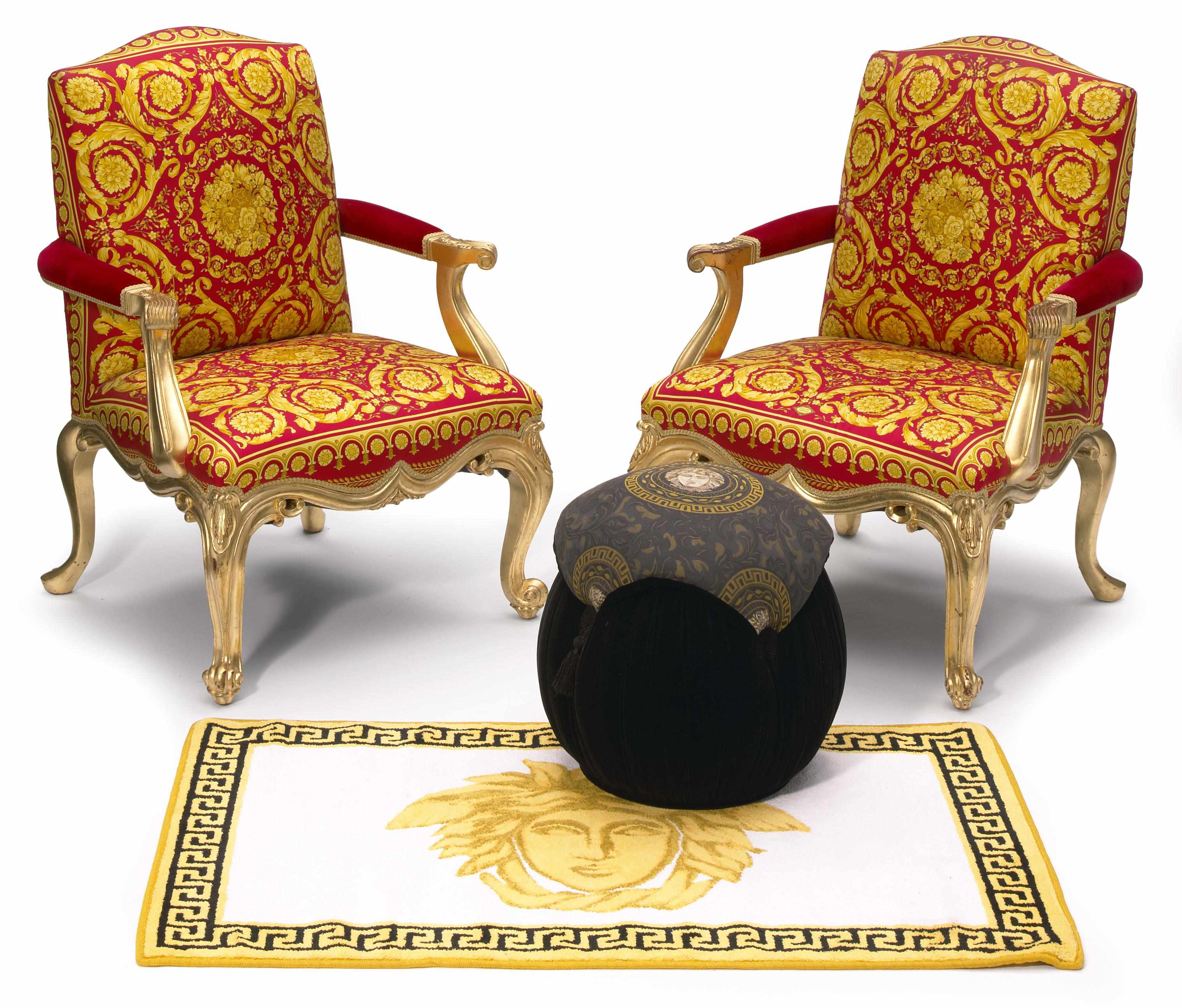 Appraisal: A pair of Gianni Versace carved giltwood painted and upholstered