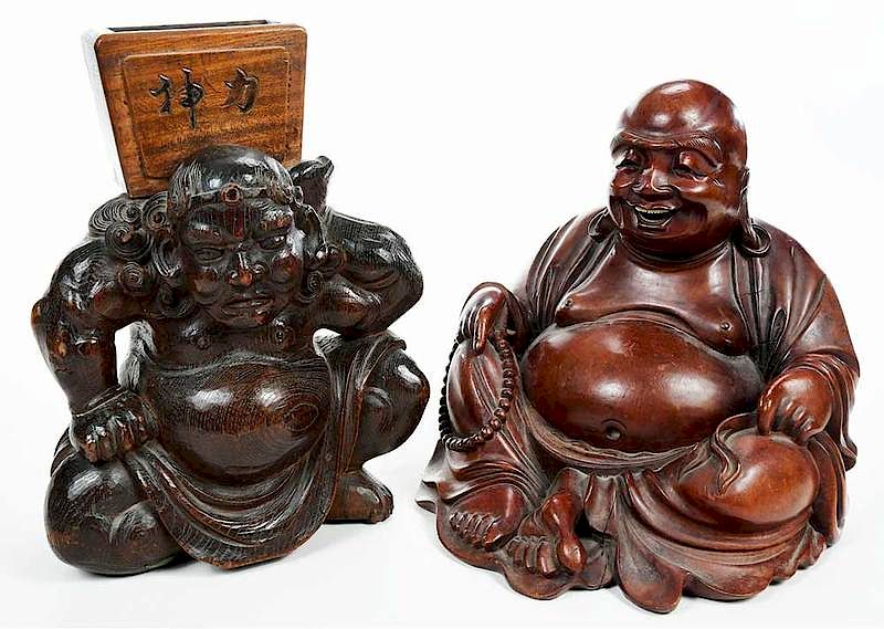 Appraisal: Two Asian Carved Wood Figures th century seated Buddha seated