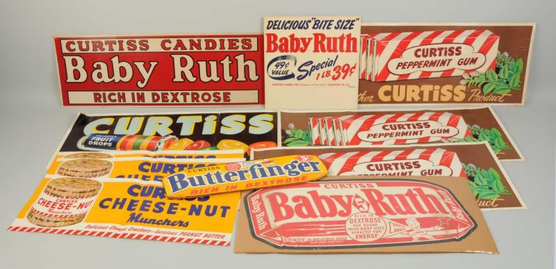 Appraisal: Lot Of Curtiss Candy Signs This lot includes thirteen assorted