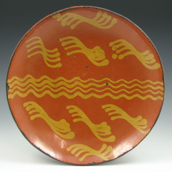 Appraisal: Greg Shooner redware charger with decoration of yellow wavy lines