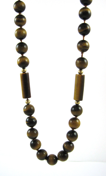 Appraisal: TIGER EYE AND YELLOW GOLD NECKLACE consisting of spherical tiger